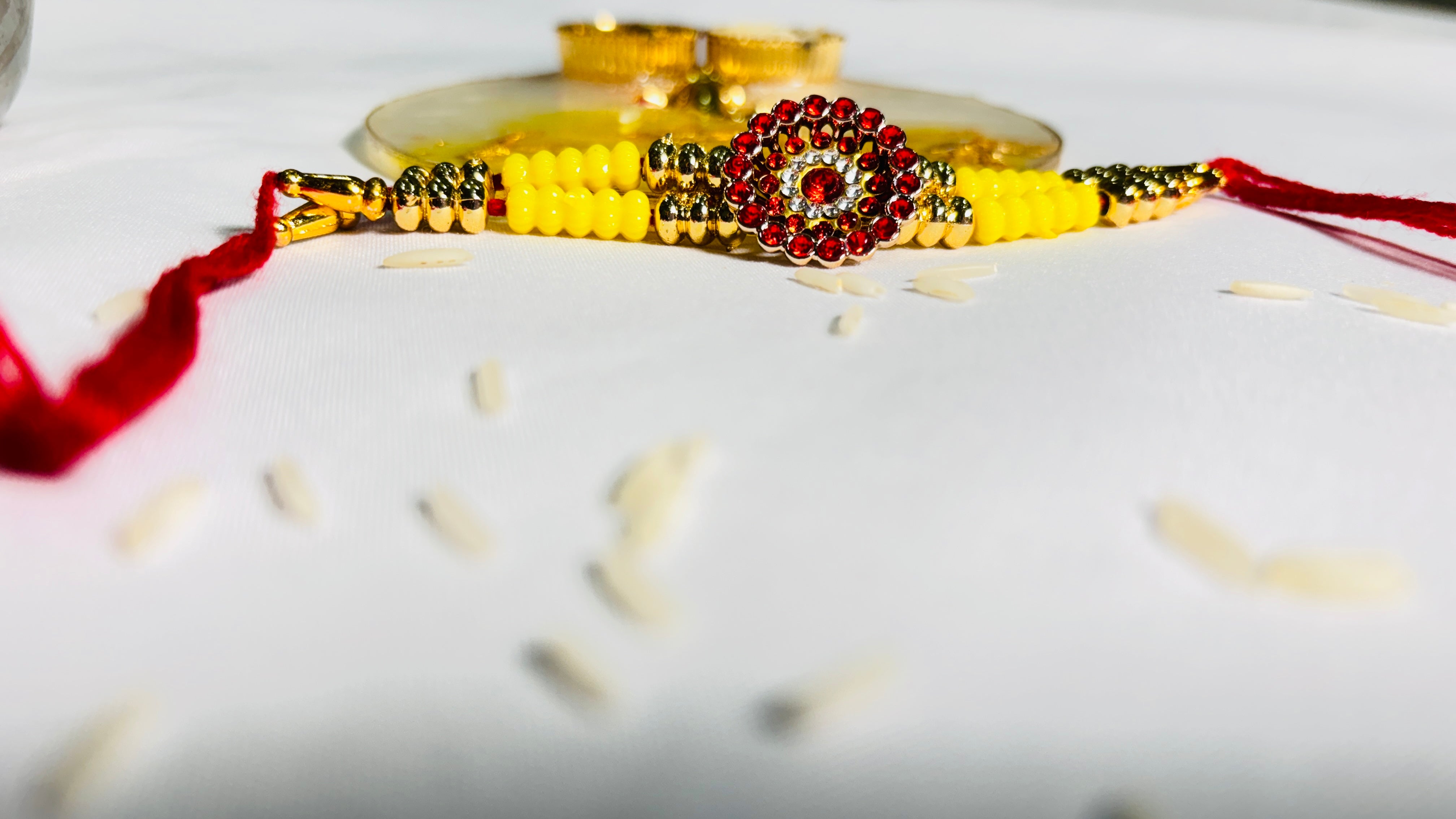 Premium Designer Rakhi Set of 12 for Brother featuring fancy handmade traditional and modern rakhi designs with decorative beads and silk threads.