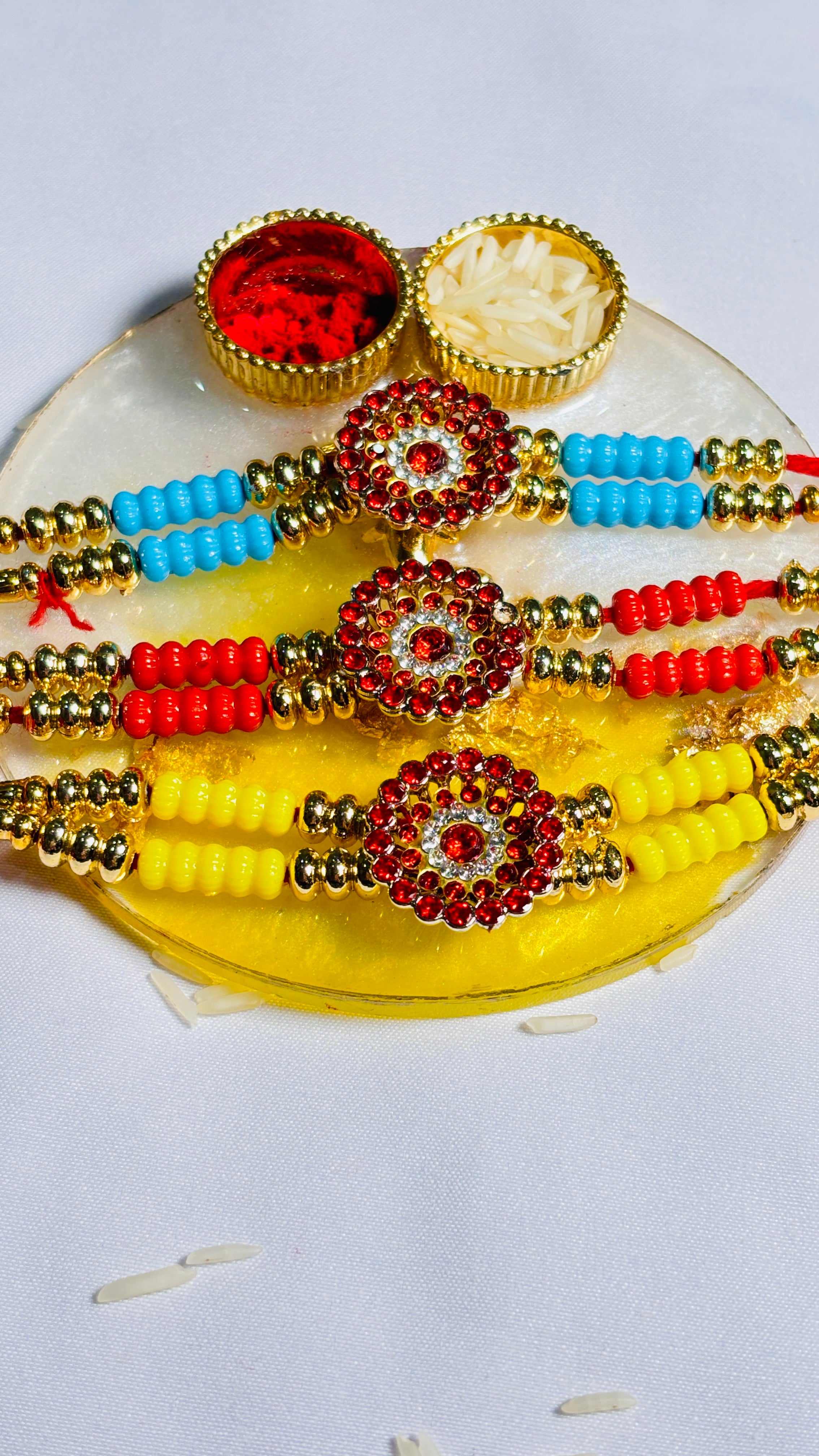 Premium Designer Rakhi Set of 12 for Brother featuring fancy handmade traditional and modern rakhi designs with decorative beads and silk threads.