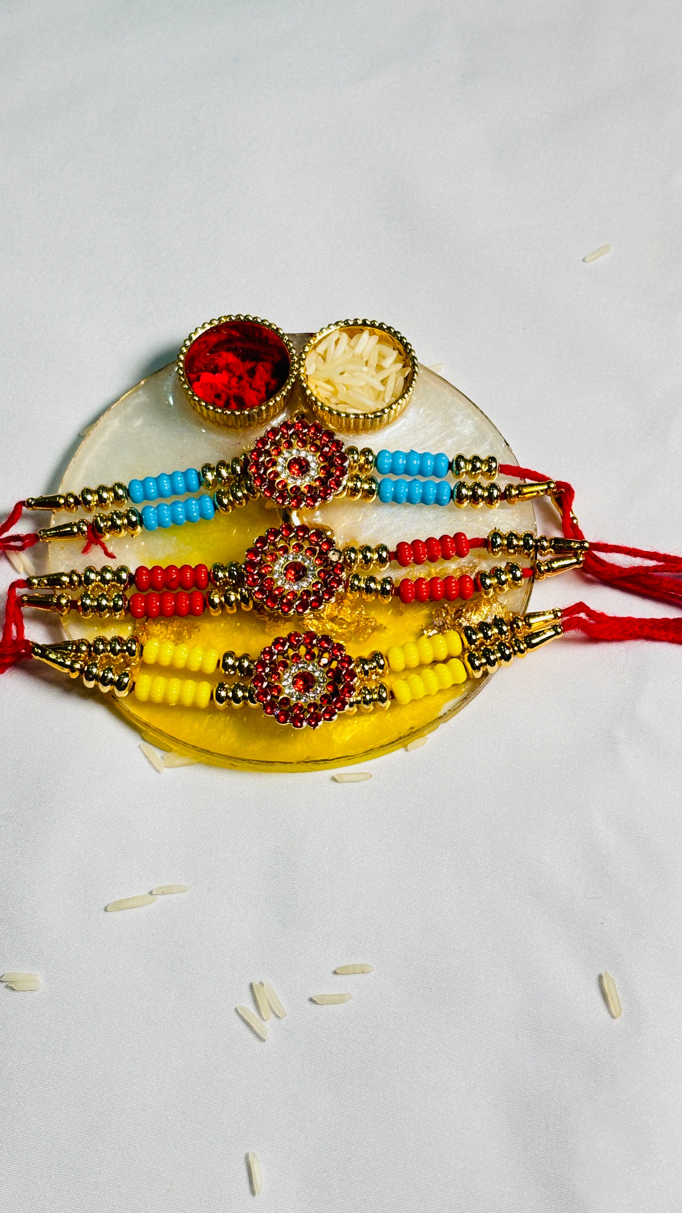 Premium Designer Rakhi Set of 12 for Brother featuring fancy handmade traditional and modern rakhi designs with decorative beads and silk threads.