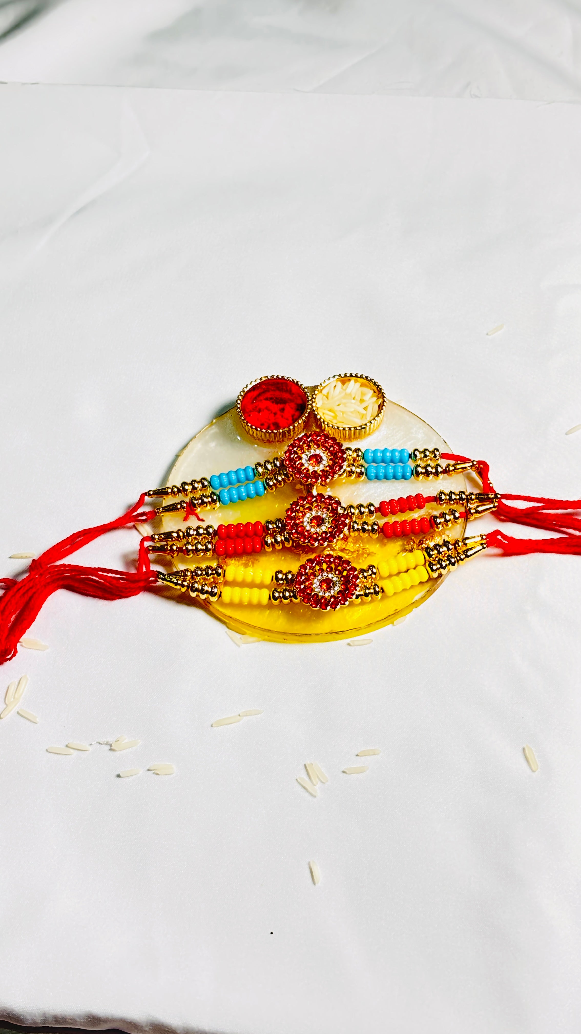 Premium Designer Rakhi Set of 12 for Brother featuring fancy handmade traditional and modern rakhi designs with decorative beads and silk threads.