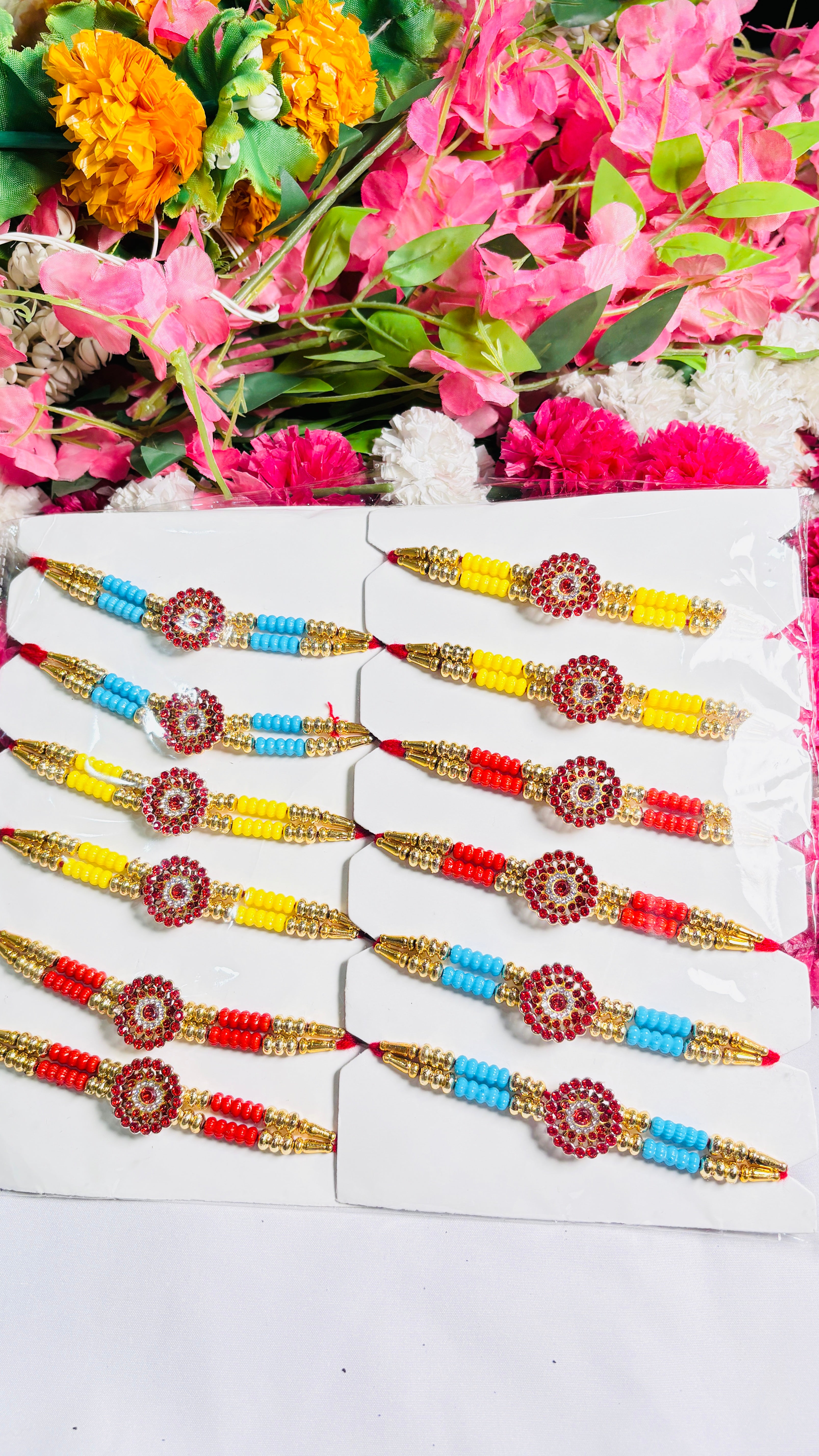 Premium Designer Rakhi Set of 12 for Brother featuring fancy handmade traditional and modern rakhi designs with decorative beads and silk threads.