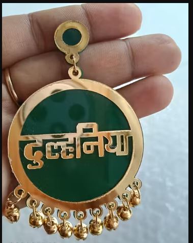 Dulhaniya Green & Gold Acrylic Gunghroo Earrings for Women & Girls featuring elegant ethnic styling with lightweight comfort and festive charm. Perfect for weddings, haldi, mehndi, festivals, parties, and traditional occasions